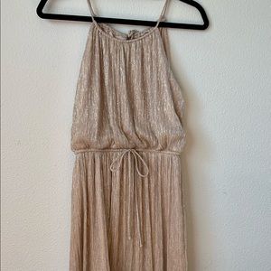 Gold sparkly dress. Length just above the knee